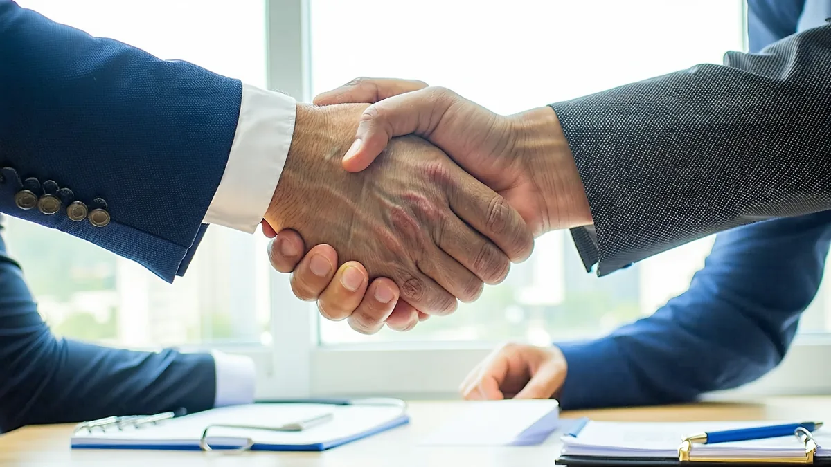 Business handshake representing tour operator and travel agency partnership